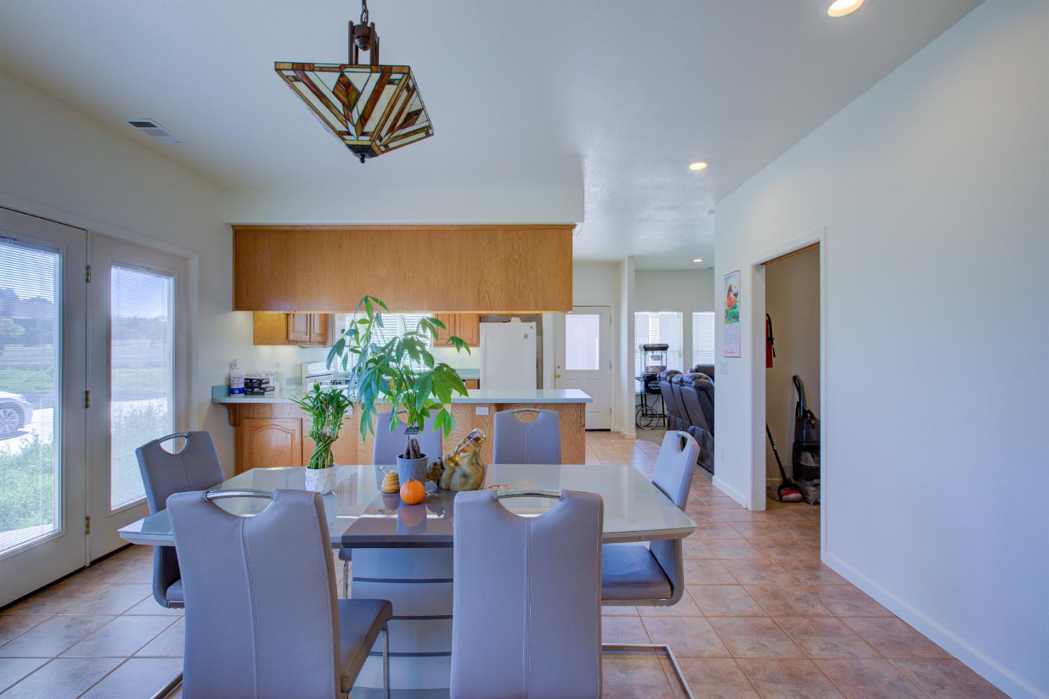 9681 Wamble Road Oakdale, CA 95361 - Photo 10 of 50 a living room with furniture and a flat screen tv