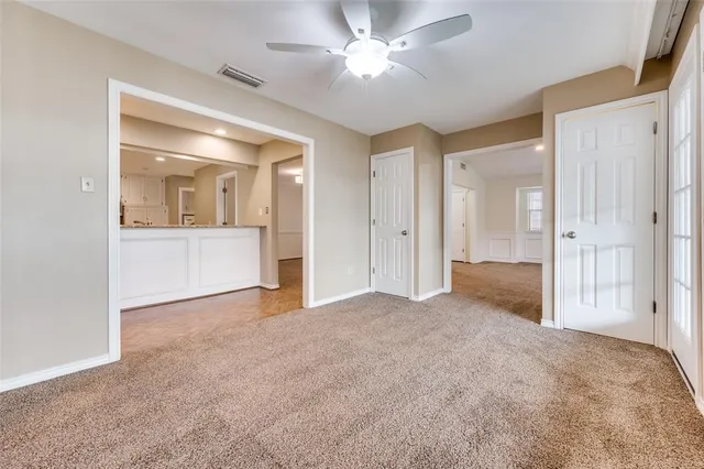 a view of empty room with a fireplace