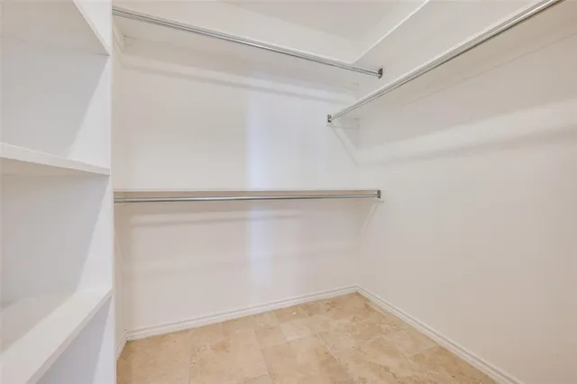 a bathroom with a granite countertop sink mirror and bathtub