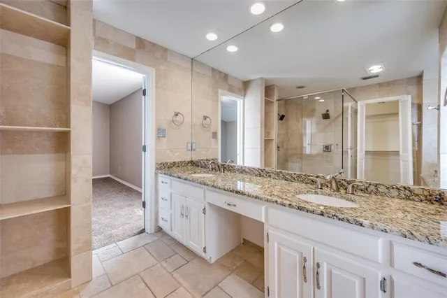 a bathroom with a glass shower door