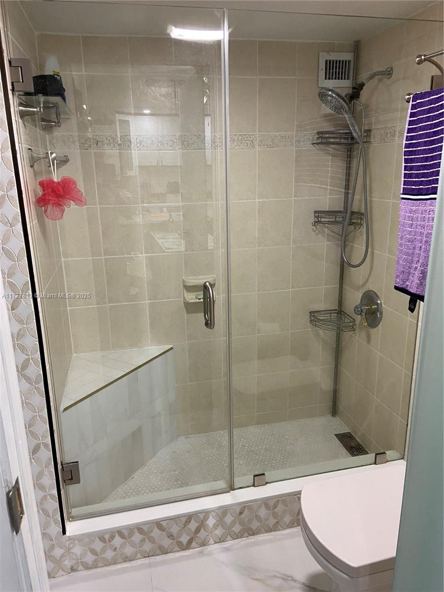 17021 North Bay Road, Unit 627 Sunny Isles Beach, FL 33160 - Photo 19 of 24 a bathroom with a shower and a sink