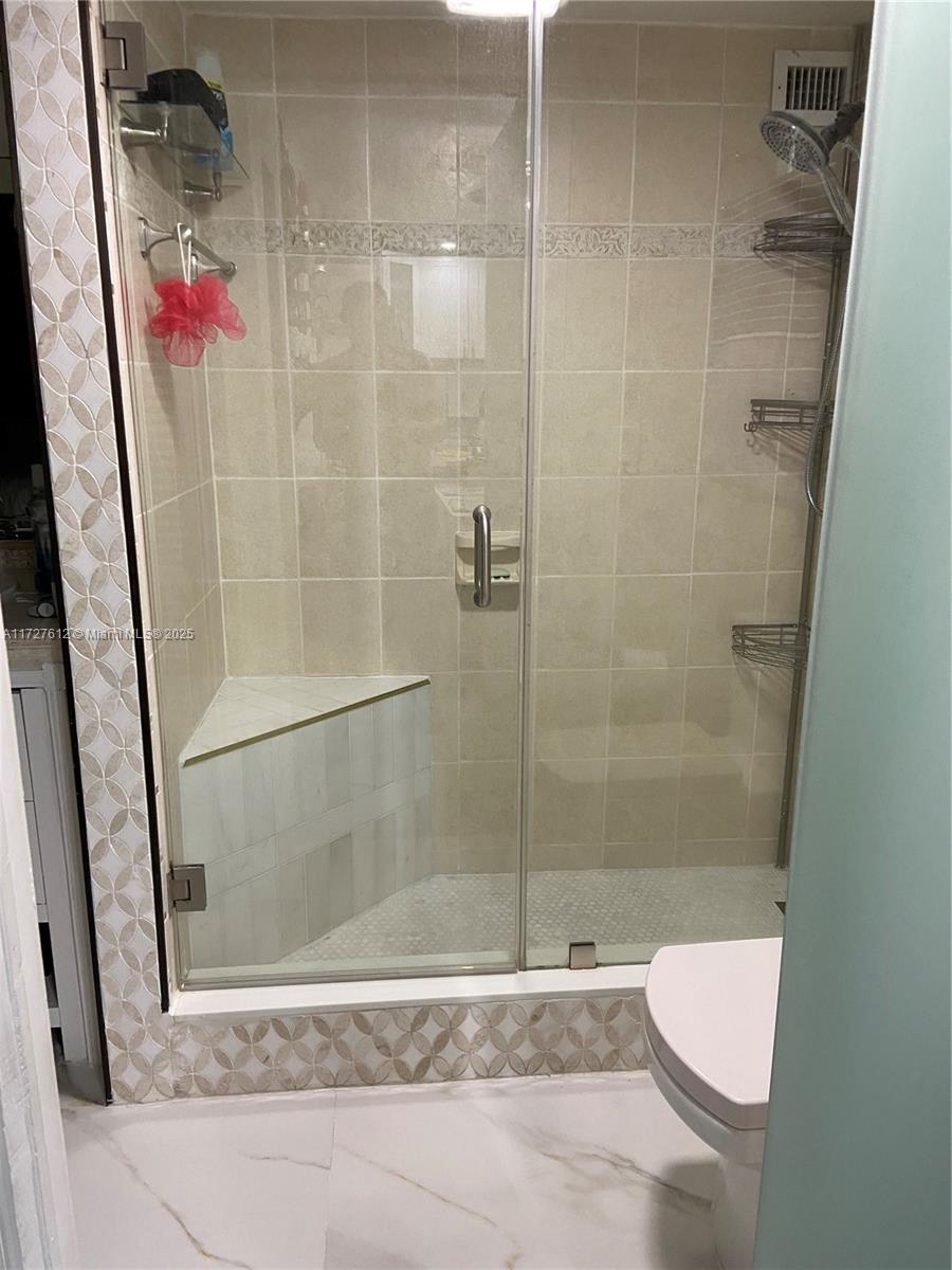17021 North Bay Road, Unit 627 Sunny Isles Beach, FL 33160 - Photo 20 of 24 a bathroom with a shower
