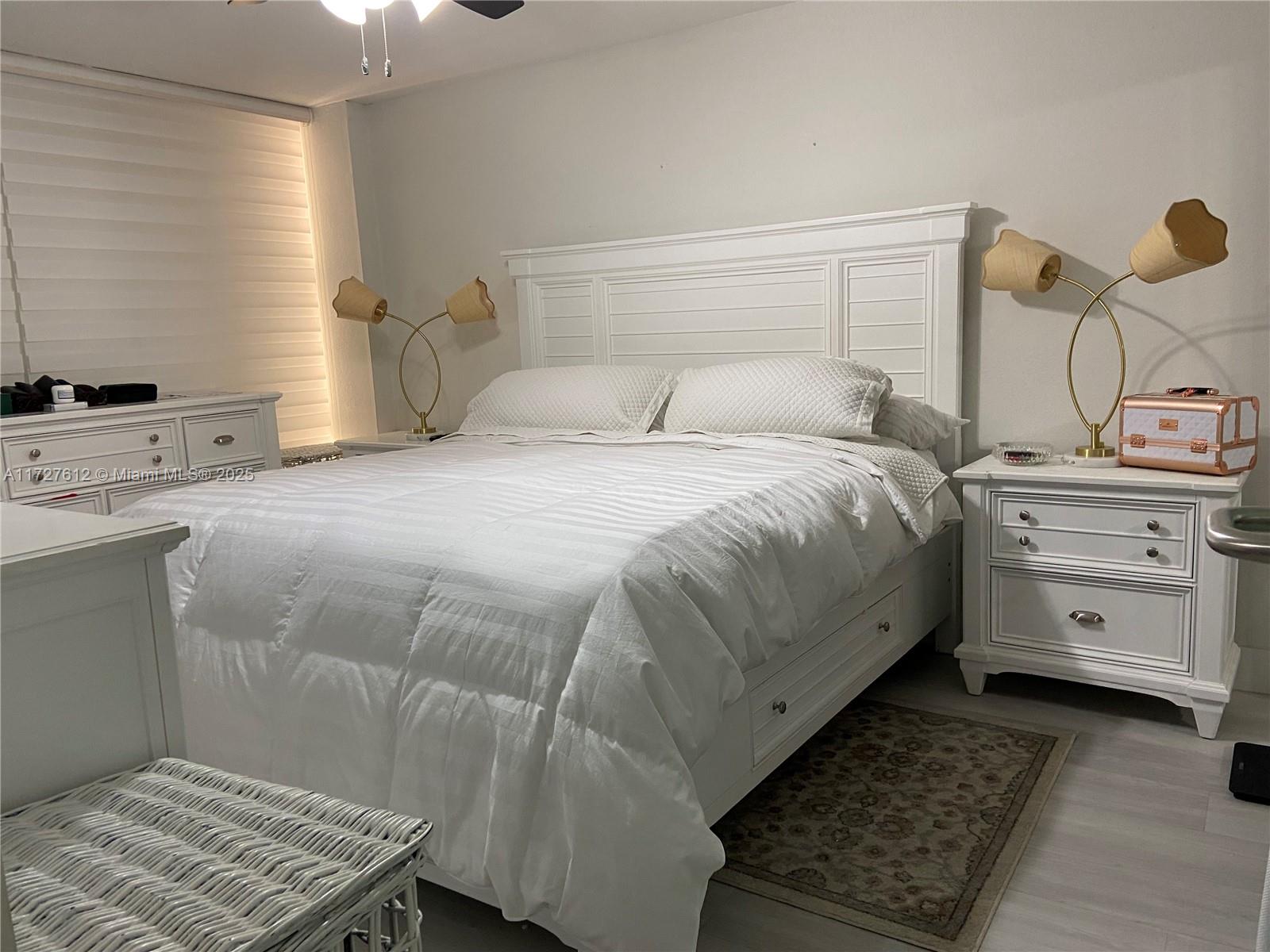 17021 North Bay Road, Unit 627 Sunny Isles Beach, FL 33160 - Photo 2 of 24 a bedroom with a bed and a window