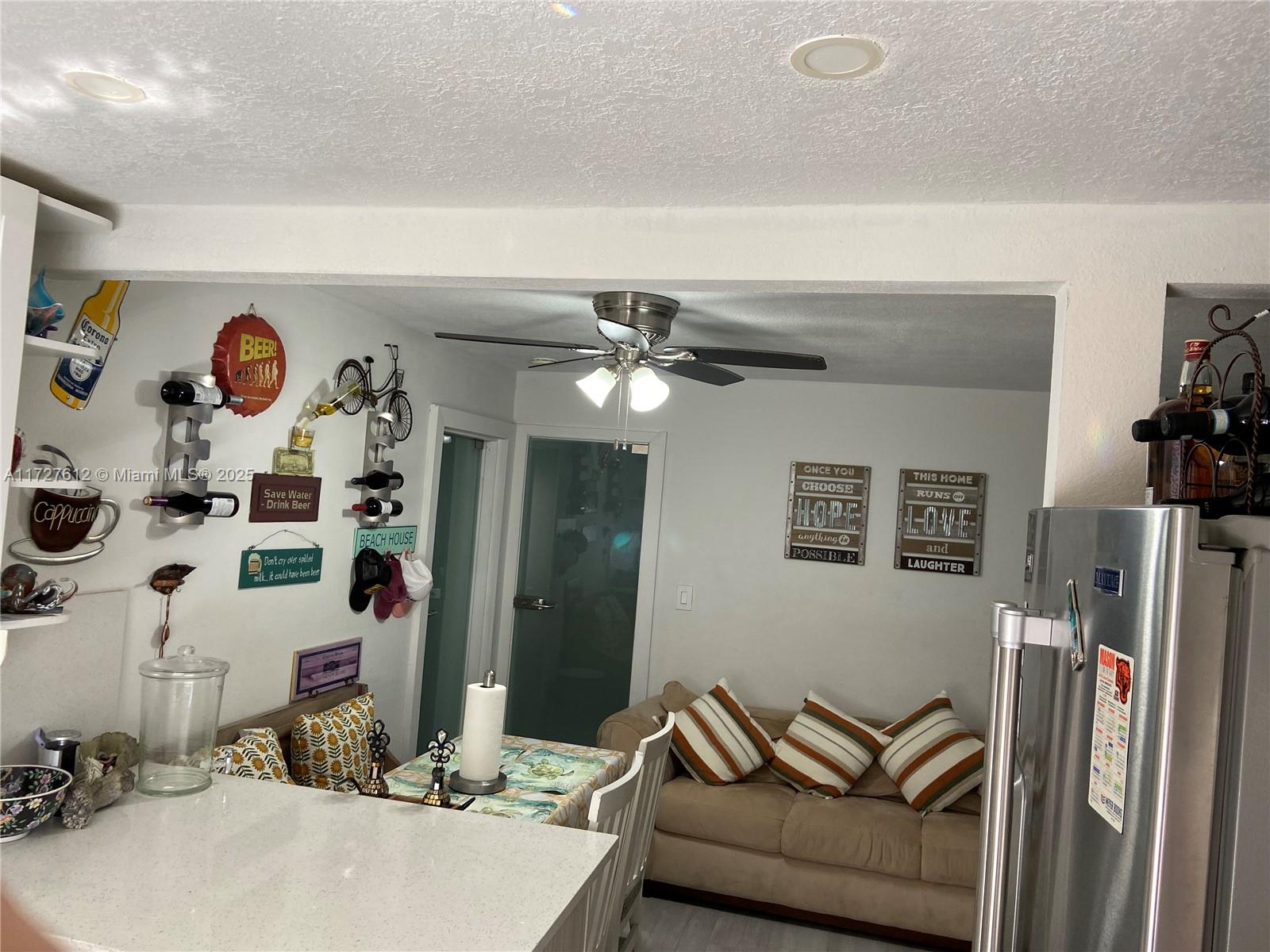 17021 North Bay Road, Unit 627 Sunny Isles Beach, FL 33160 - Photo 22 of 24 a living room with furniture and a flat screen tv