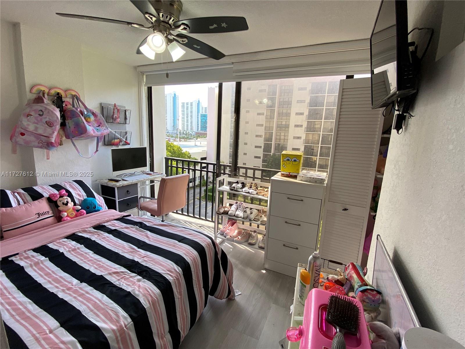 17021 North Bay Road, Unit 627 Sunny Isles Beach, FL 33160 - Photo 5 of 24 a bedroom with furniture and a large window