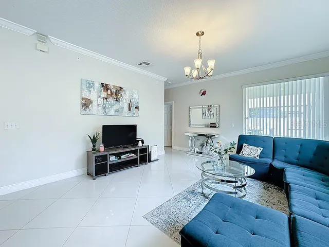 a kitchen with white cabinets a sink and dishwasher