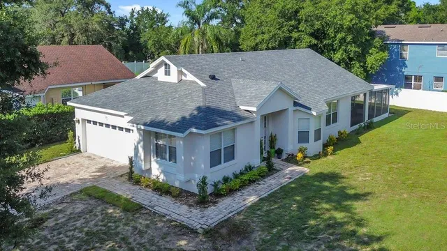 a view of a dining room with a table and chairs
