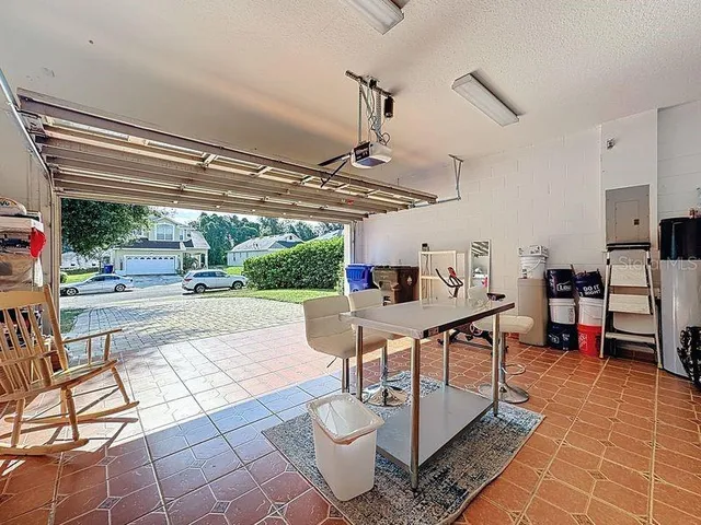 an aerial view of green landscape with trees houses and mountain view