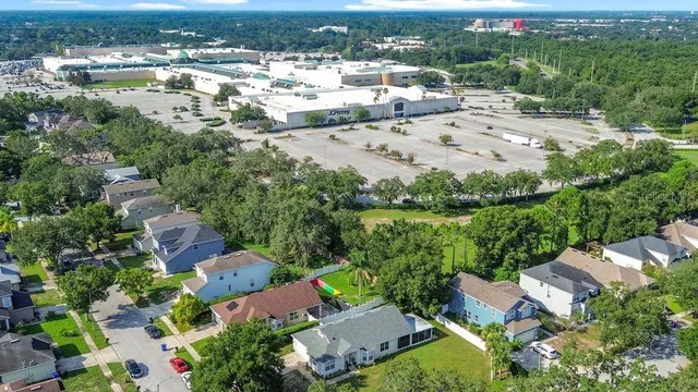 a house with swimming pool in front