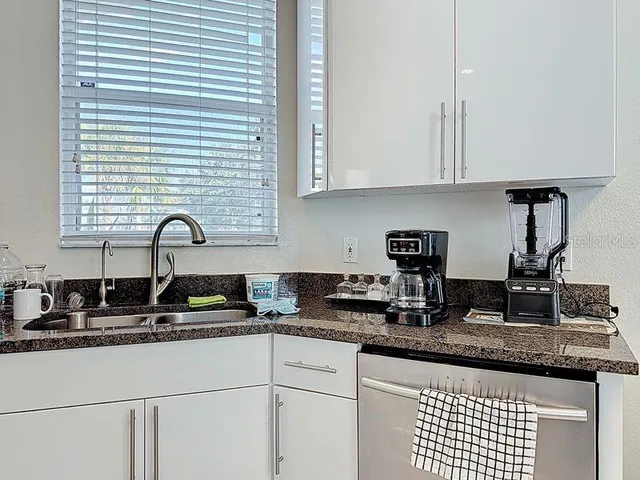 a kitchen with a sink and cabinets