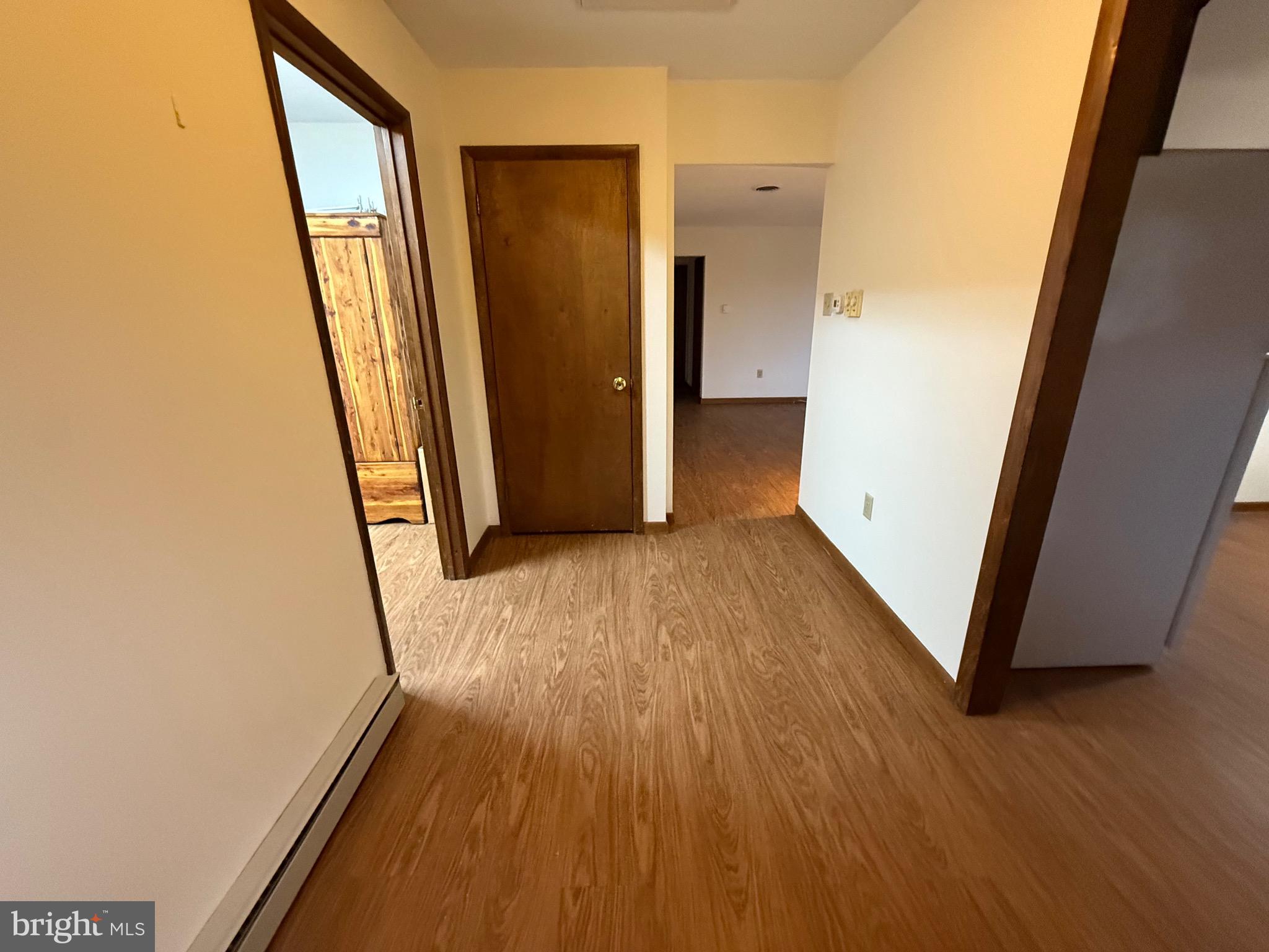 344 North Virginia Avenue Carneys Point, NJ 08069 - Photo 3 of 16 a view of a hallway with wooden floor and staircase