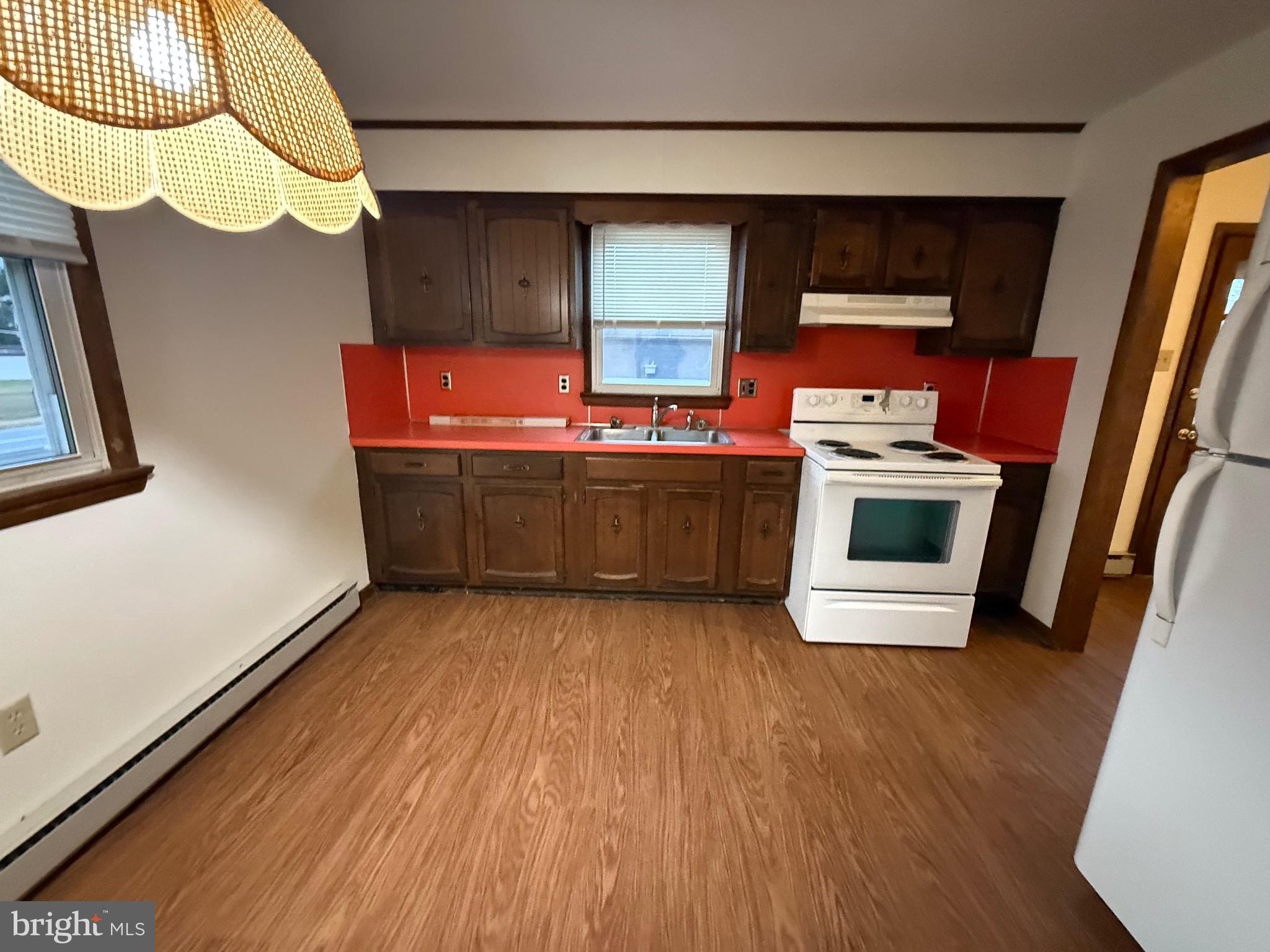 344 North Virginia Avenue Carneys Point, NJ 08069 - Photo 6 of 16 a view of kitchen with wooden floor and electronic appliances