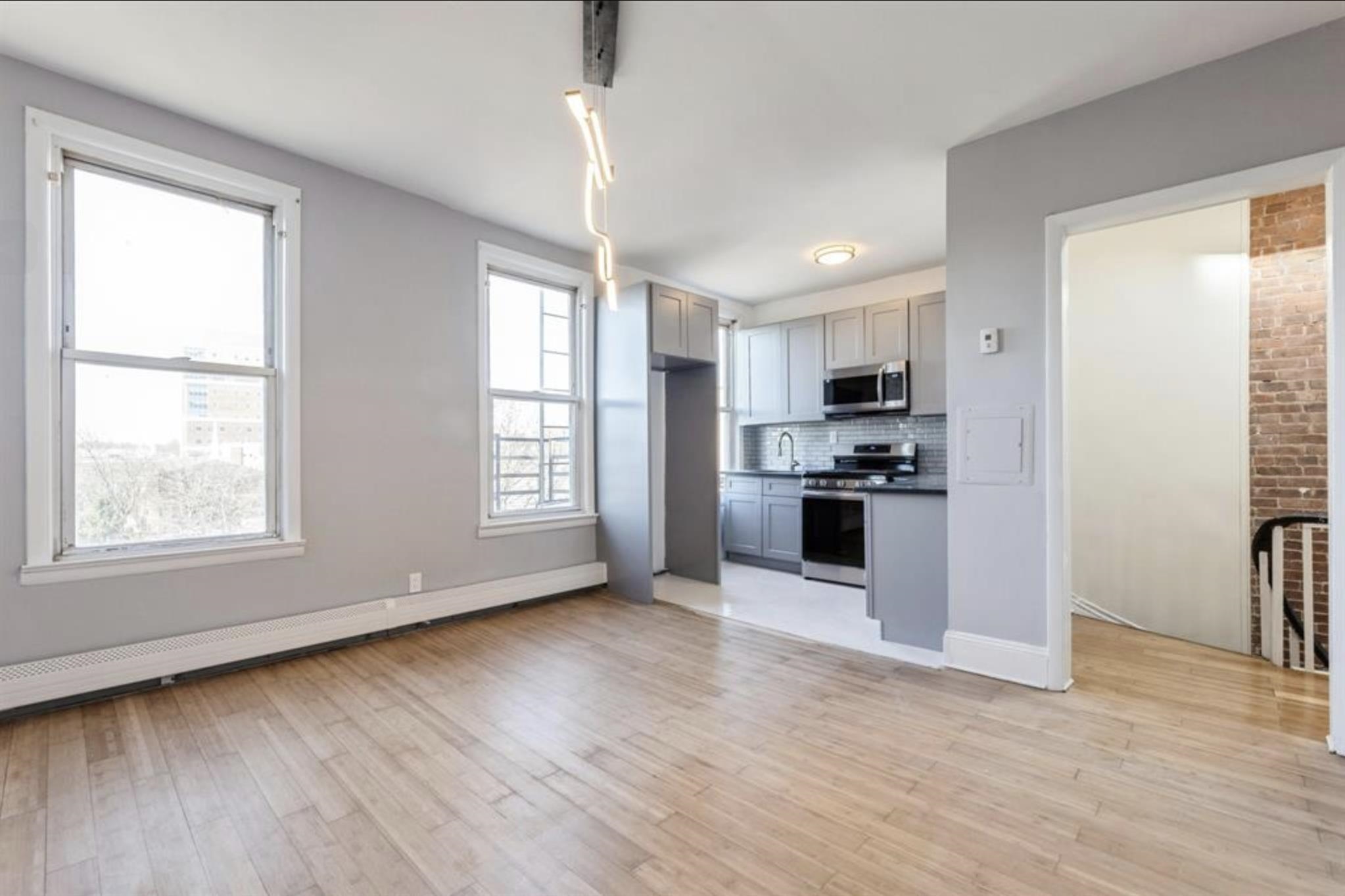 291 Forrest Street, Unit 2 Jersey City, NJ 07304 - Photo 13 of 17 a view of kitchen with sink and refrigerator