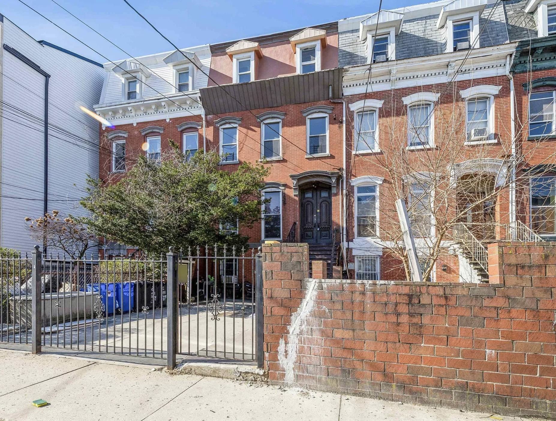 291 Forrest Street, Unit 2 Jersey City, NJ 07304 - Photo 5 of 17 a front view of a building with glass windows and door