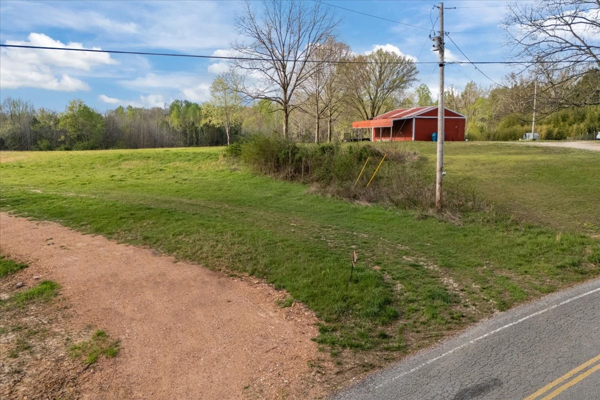 1759 McKelvy Road Camden, TN 38320 - Photo 7 of 20 a view of a back yard