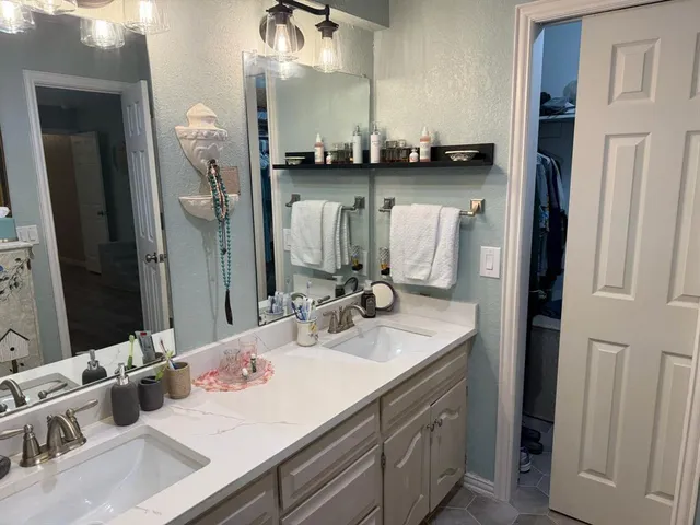 a bathroom with a sink and a mirror