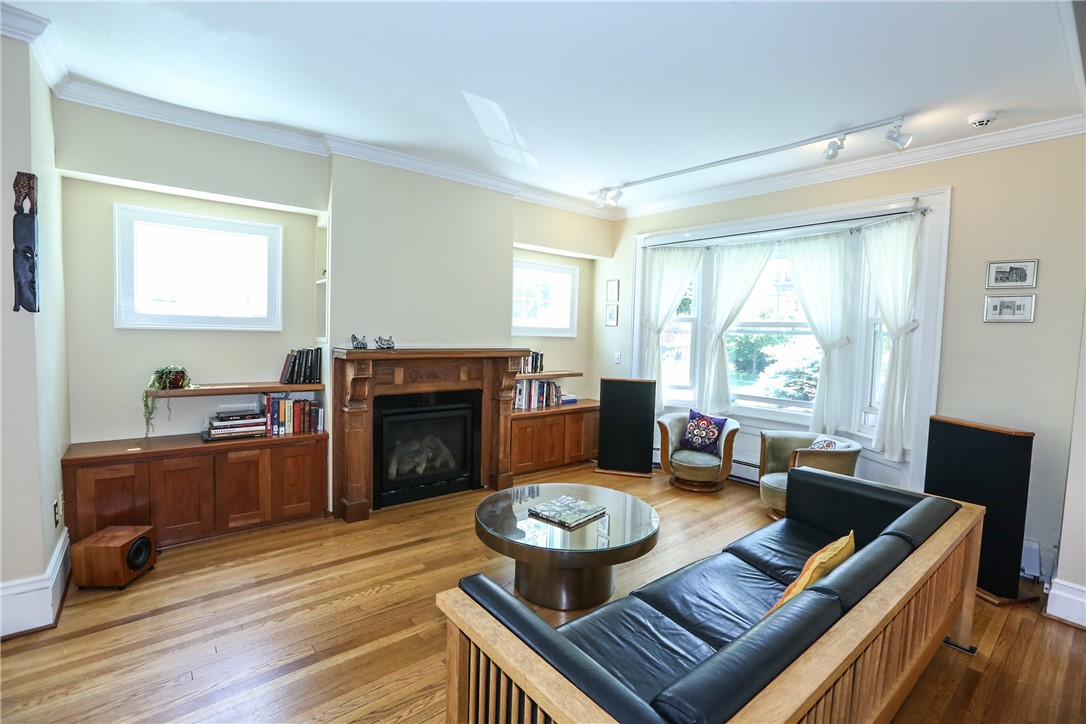 244 Barrington Street Rochester, NY 14607 - Photo 5 of 30 Newer gas fireplace flanked by built-ins