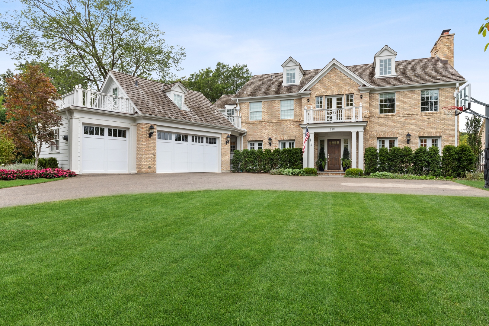 739 East Illinois Road Lake Forest, IL 60045 - Photo 1 of 39 a front view of a house with a yard and trees