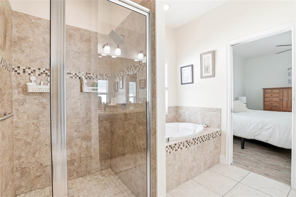 2906 West Douglas Street Tampa, FL 33607 - Photo 20 of 36 a bathroom with a tub shower and sink