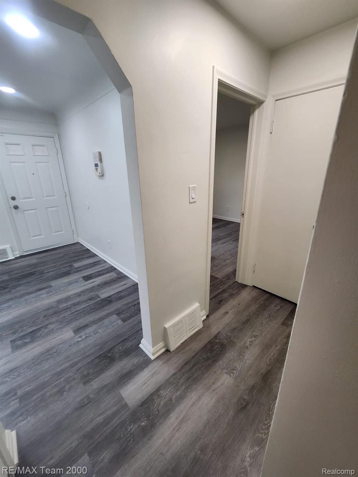 8244 Heyden Detroit, MI 48228 - Photo 6 of 21 Modern entryway with wood-finish flooring throughout, recessed lighting, and clean white walls