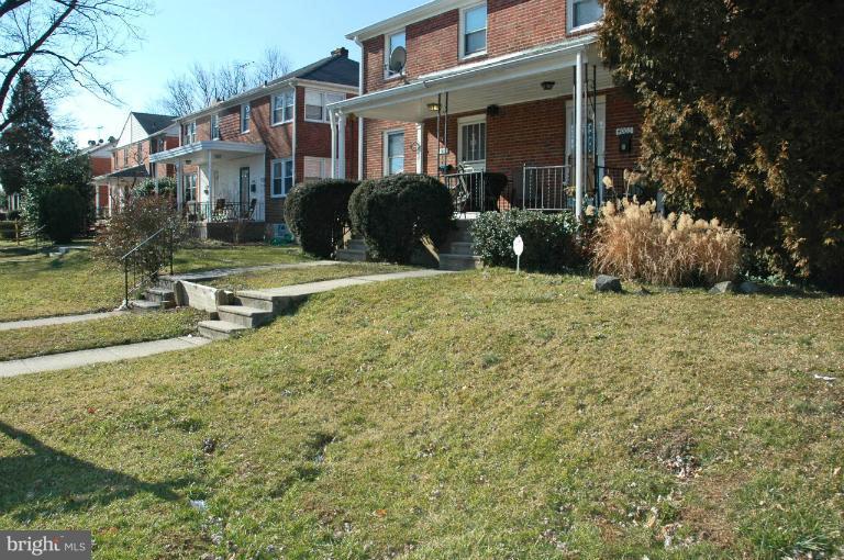 4001 Brookhill Road Baltimore, MD 21215 - Photo 2 of 3 a front view of a house with garden