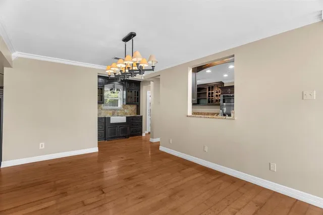 a very nice looking room with wooden floor