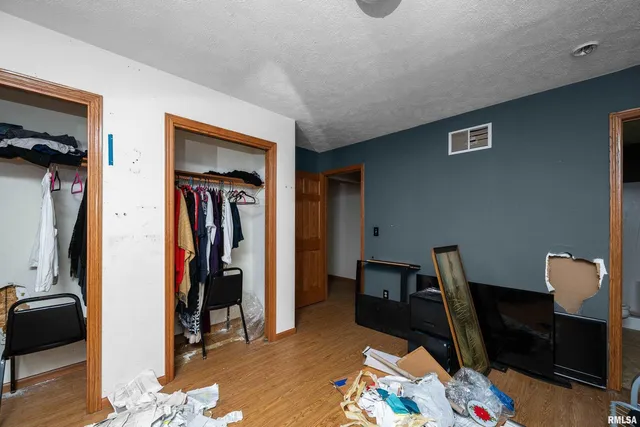 a view of a workspace with furniture and closet