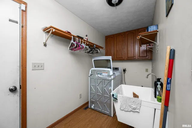 a view of storage and utility room with a sink
