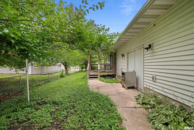 a view of a back yard with green space