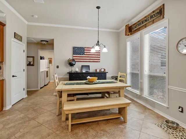 a view of hall way with furniture and windows