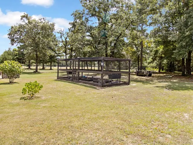 a view of swimming pool with an outdoor seating