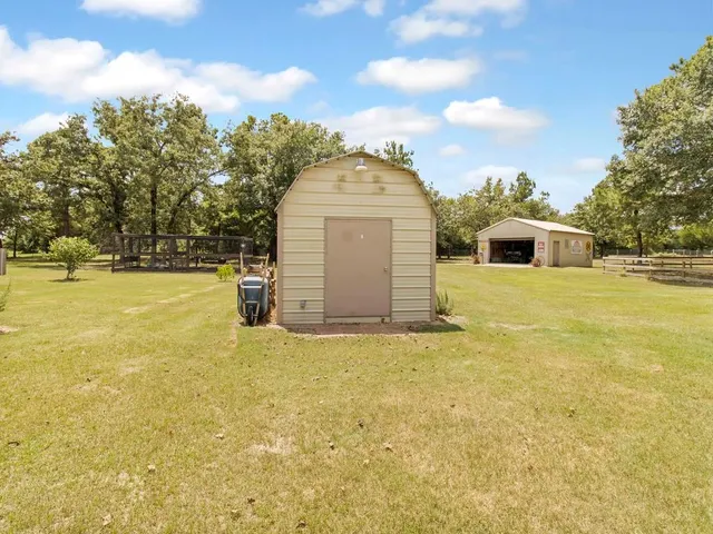a view of a swimming pool with an outdoor space and seating area