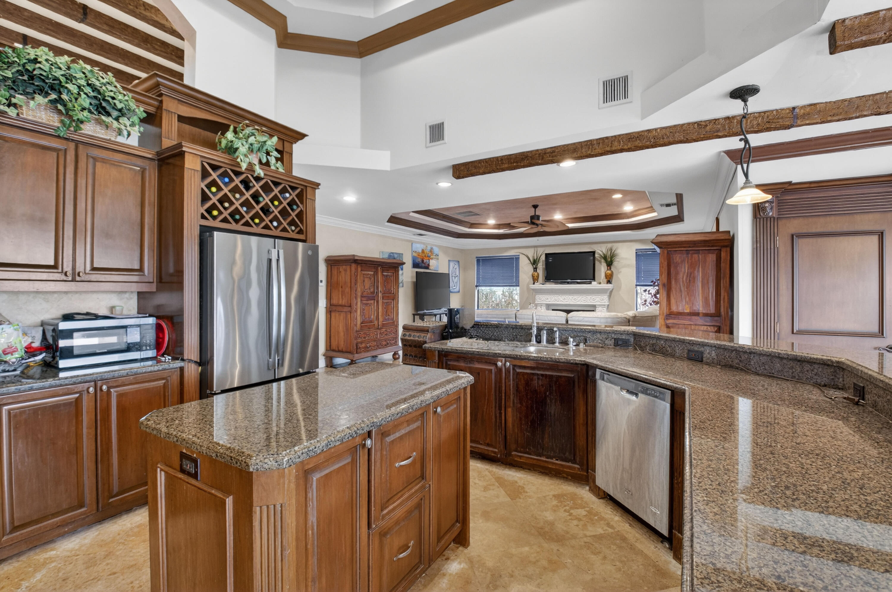 1940 Southwest 7th Place Boca Raton, FL 33486 - Photo 13 of 49 a kitchen with stainless steel appliances granite countertop a sink a stove and a refrigerator