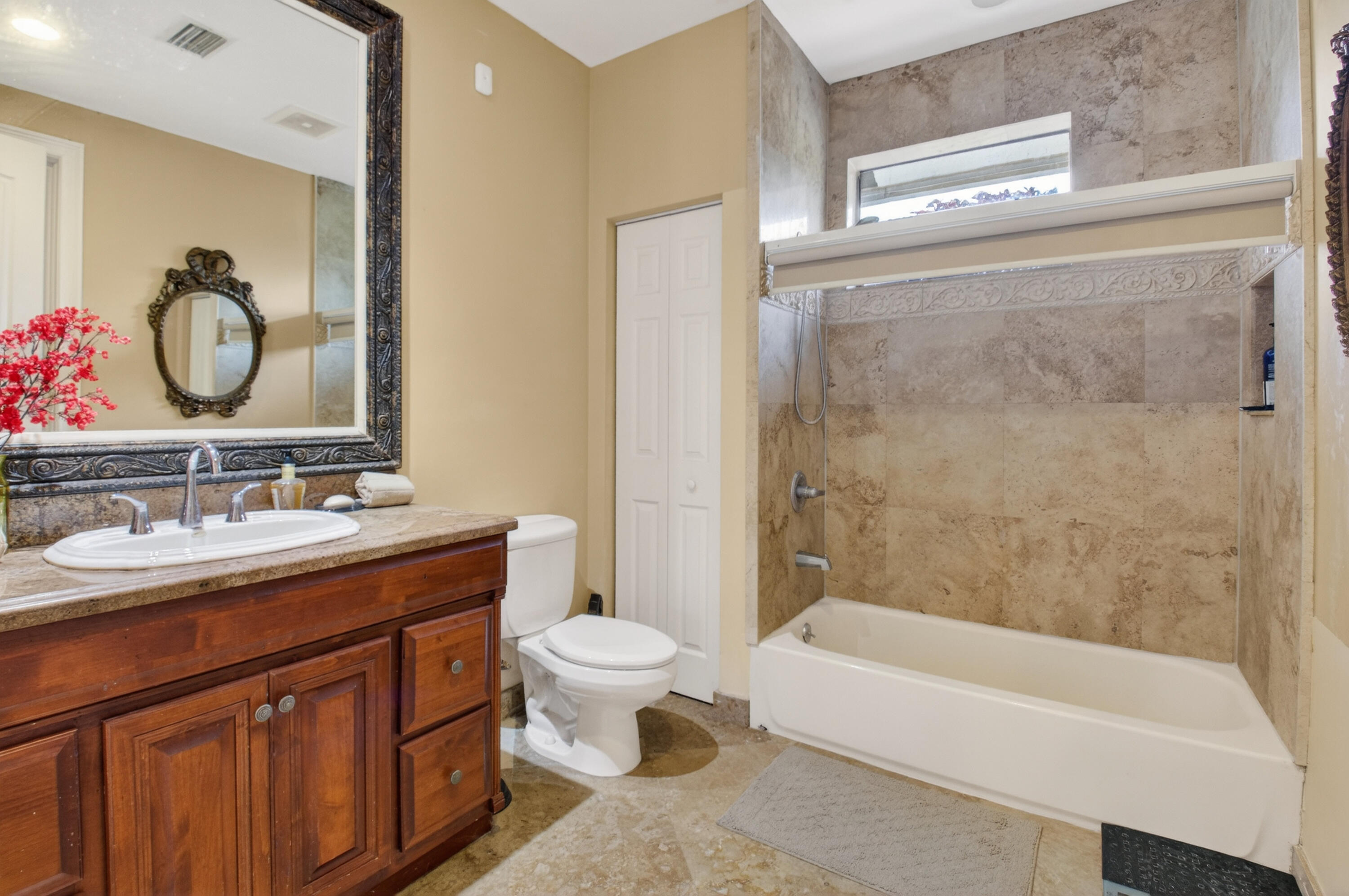 1940 Southwest 7th Place Boca Raton, FL 33486 - Photo 23 of 49 a bathroom with a bathtub shower sink mirror and toilet