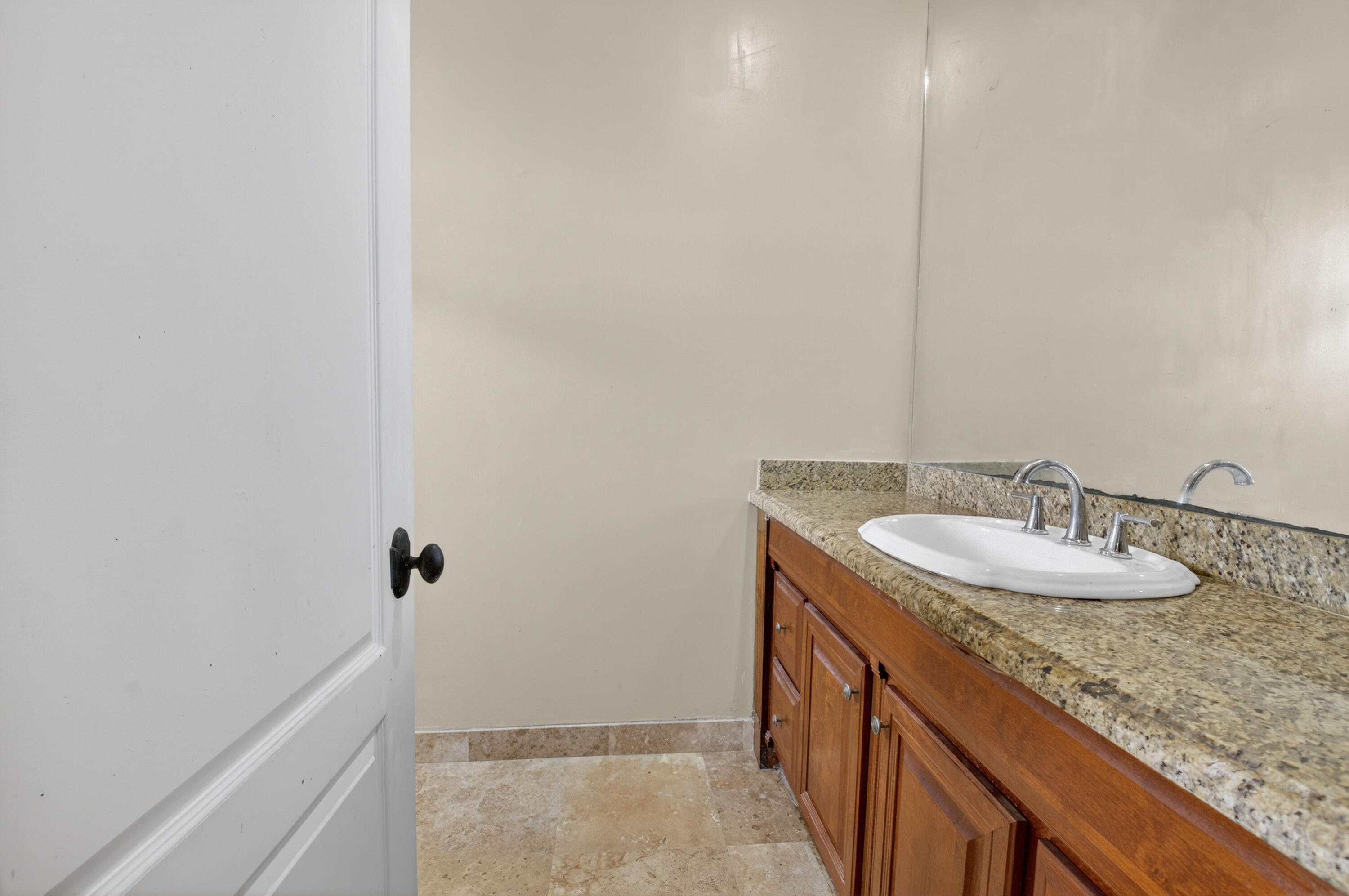 1940 Southwest 7th Place Boca Raton, FL 33486 - Photo 25 of 49 a bathroom with a granite countertop sink and a mirror
