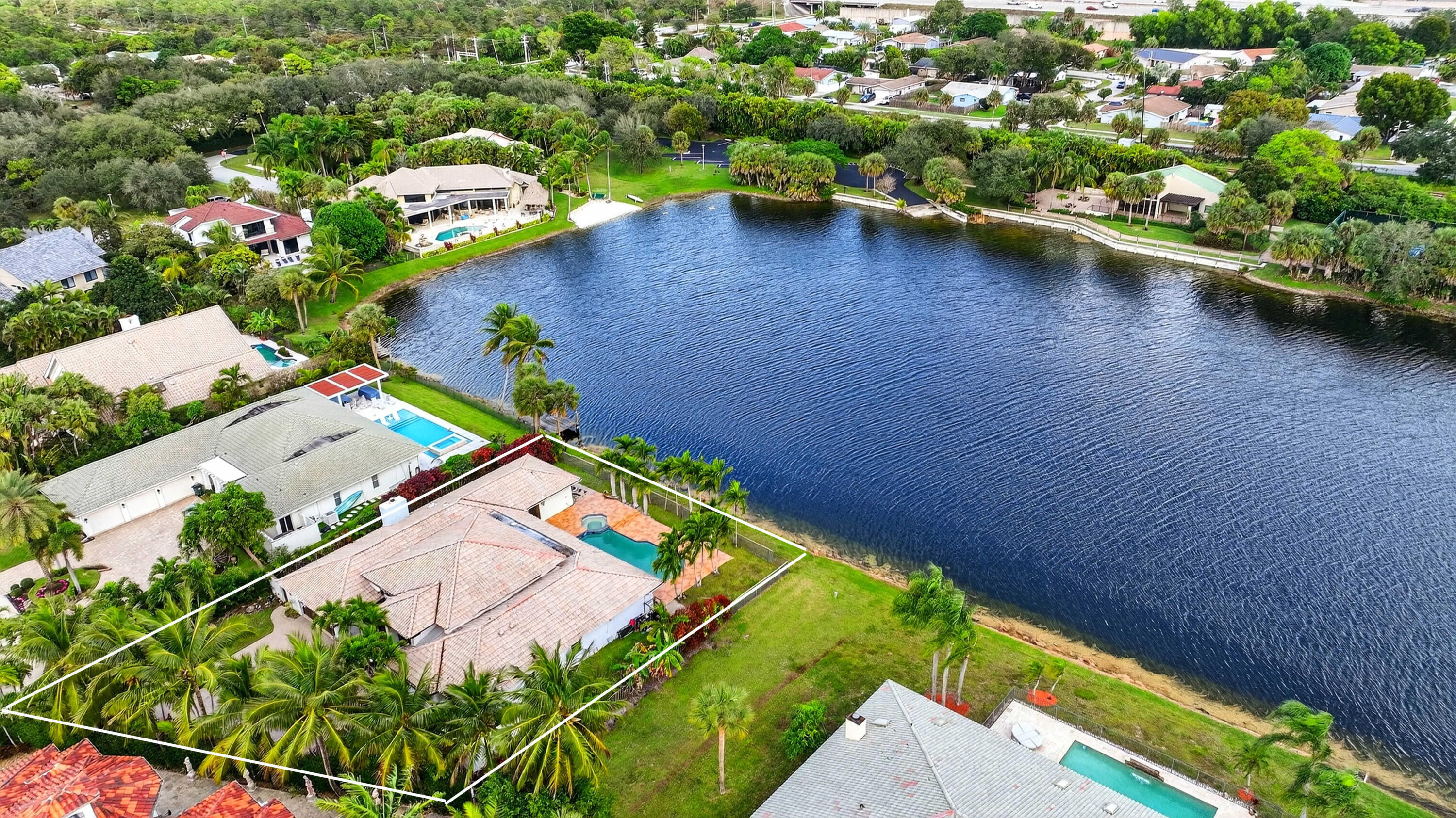 1940 Southwest 7th Place Boca Raton, FL 33486 - Photo 41 of 49 an aerial view of a house with a garden and swimming pool