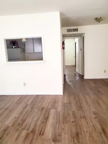 a view of a living room with wooden floor