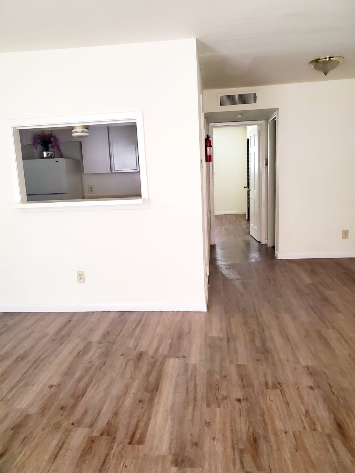3003 Broadway Street Houston, TX 77017 - Photo 2 of 6 a view of a living room with wooden floor