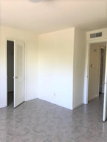 an empty room with closet