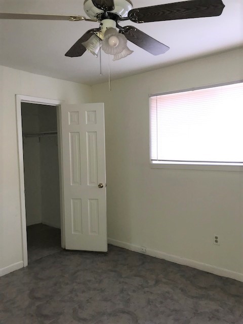 3003 Broadway Street Houston, TX 77017 - Photo 6 of 6 an empty room with a ceiling fan and a window