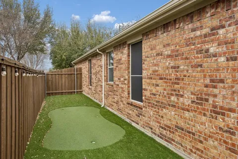 a view of a backyard with green space