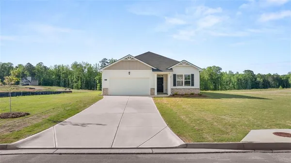 a front view of a house with yard