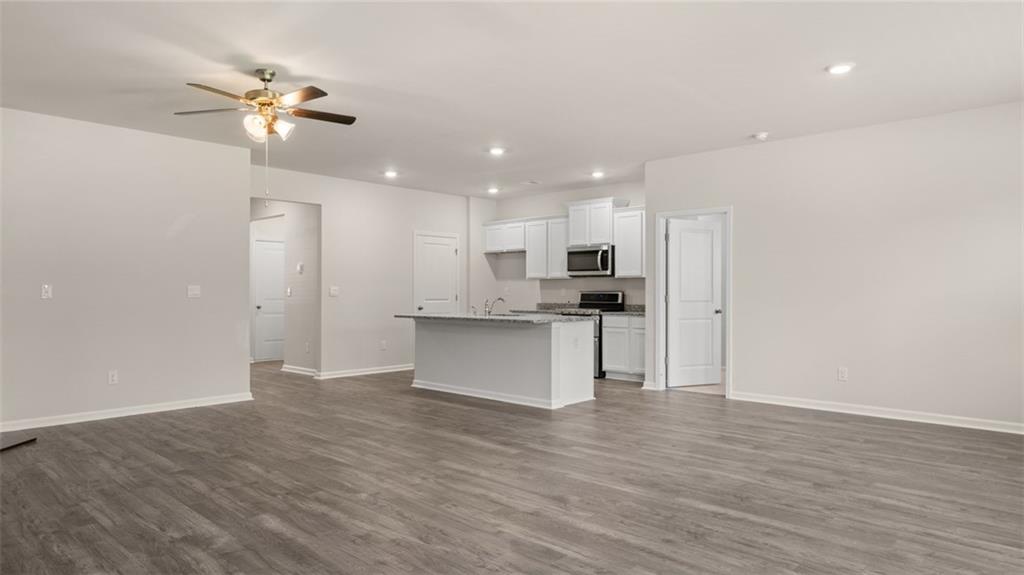 216 Cattle Drive Perry, GA 31069 - Photo 15 of 32 a view of kitchen with refrigerator and white cabinets