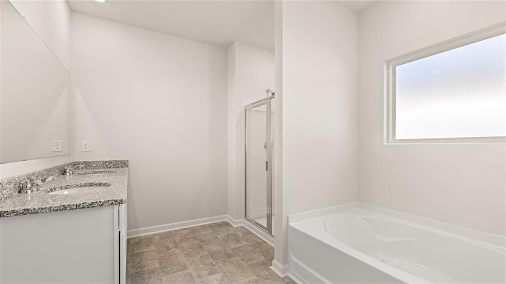 216 Cattle Drive Perry, GA 31069 - Photo 20 of 32 a bathroom with a tub sink and vanity