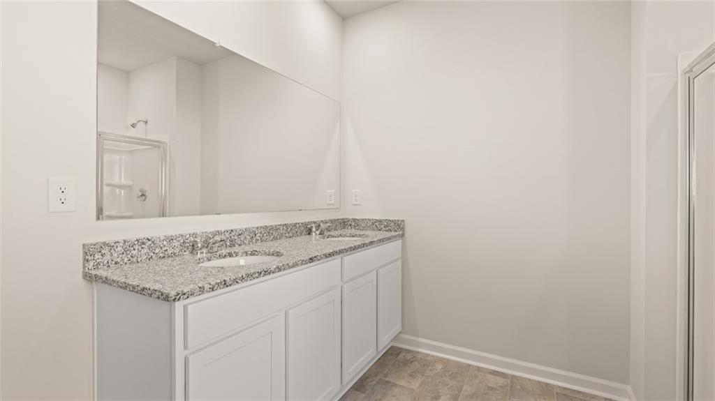 216 Cattle Drive Perry, GA 31069 - Photo 21 of 32 a utility room with granite countertop cabinets and sink