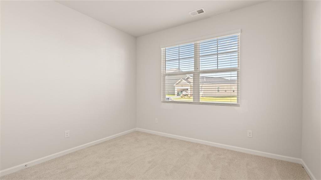 216 Cattle Drive Perry, GA 31069 - Photo 24 of 32 an empty room with a window