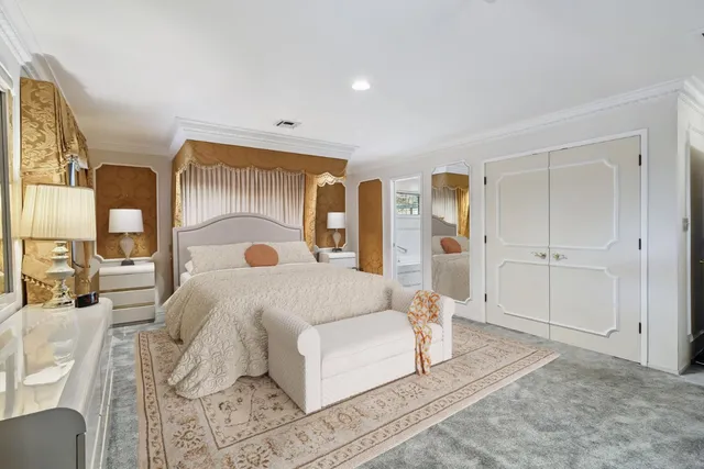 a bed room with a bed and a painting