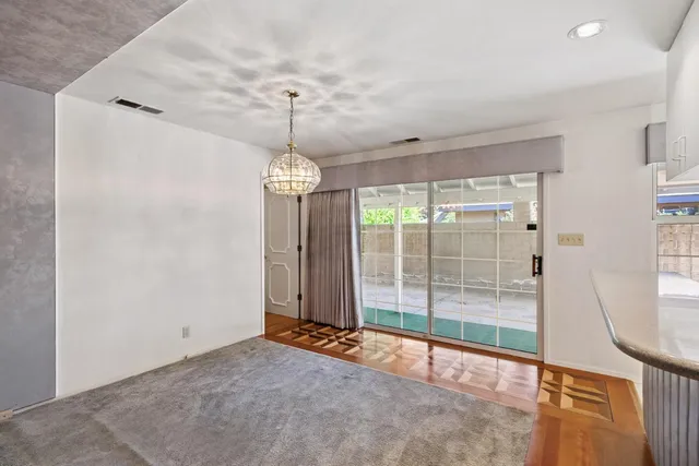 a view of a room with windows and entryway