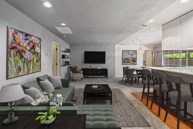 a living room with furniture and flat screen tv