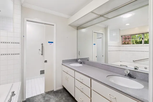 a bathroom with a glass shower door
